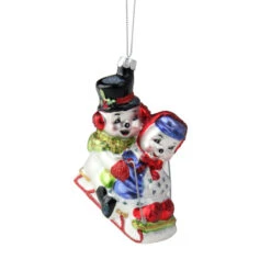 Northlight 4.5" White And Red Cheerful Sledding Snowmen Couple Glass Christmas Ornament